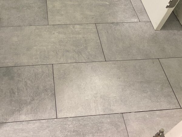 Installing-tile-flooring-as-we-remodel-a-bathroom - Brucksch And Sons Contracting - Brucksch And Sons Contracting