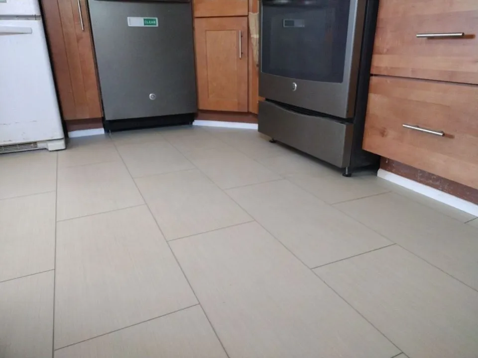 Gray-beige vinyl plank flooring in kitchen