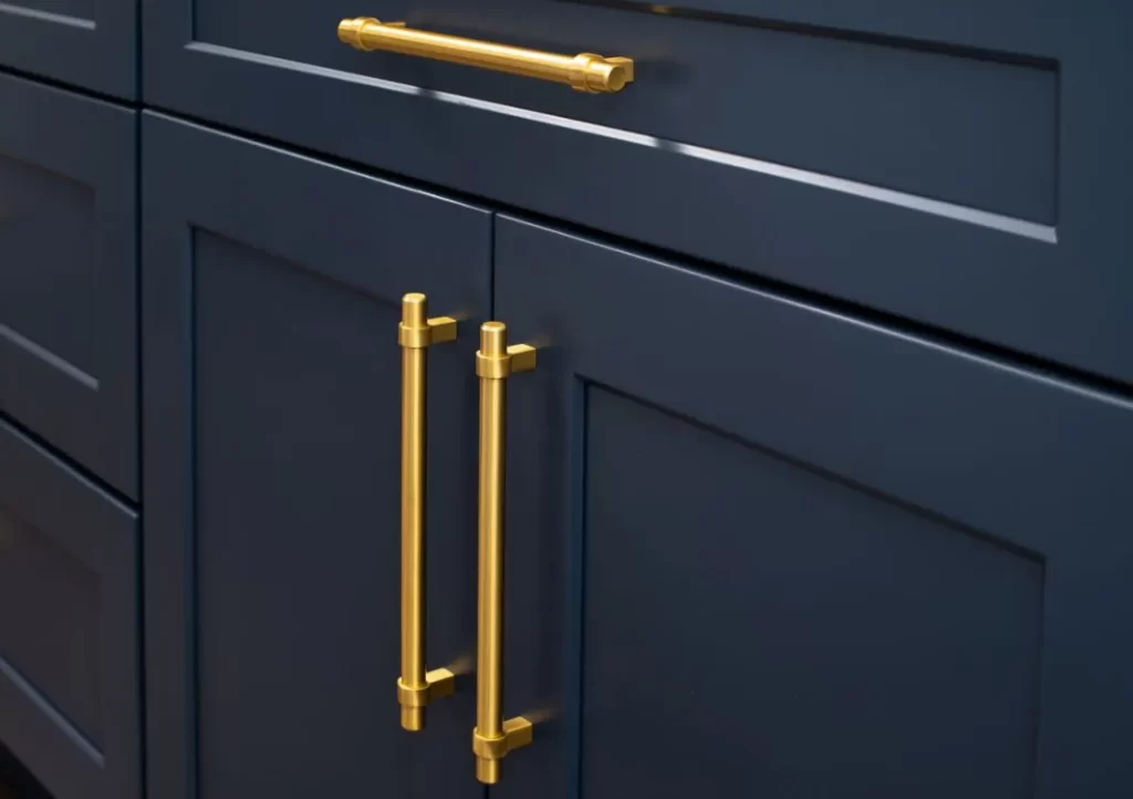 Dark blue cabinets with gold pulls