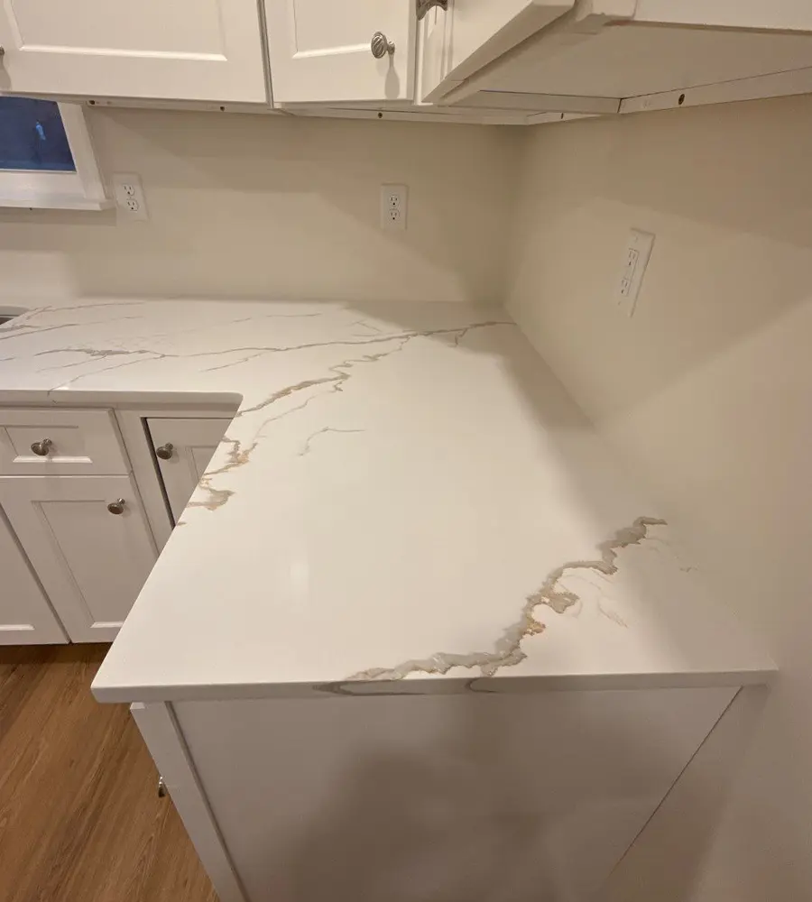 White quartz kitchen countertop with subtle marble veins