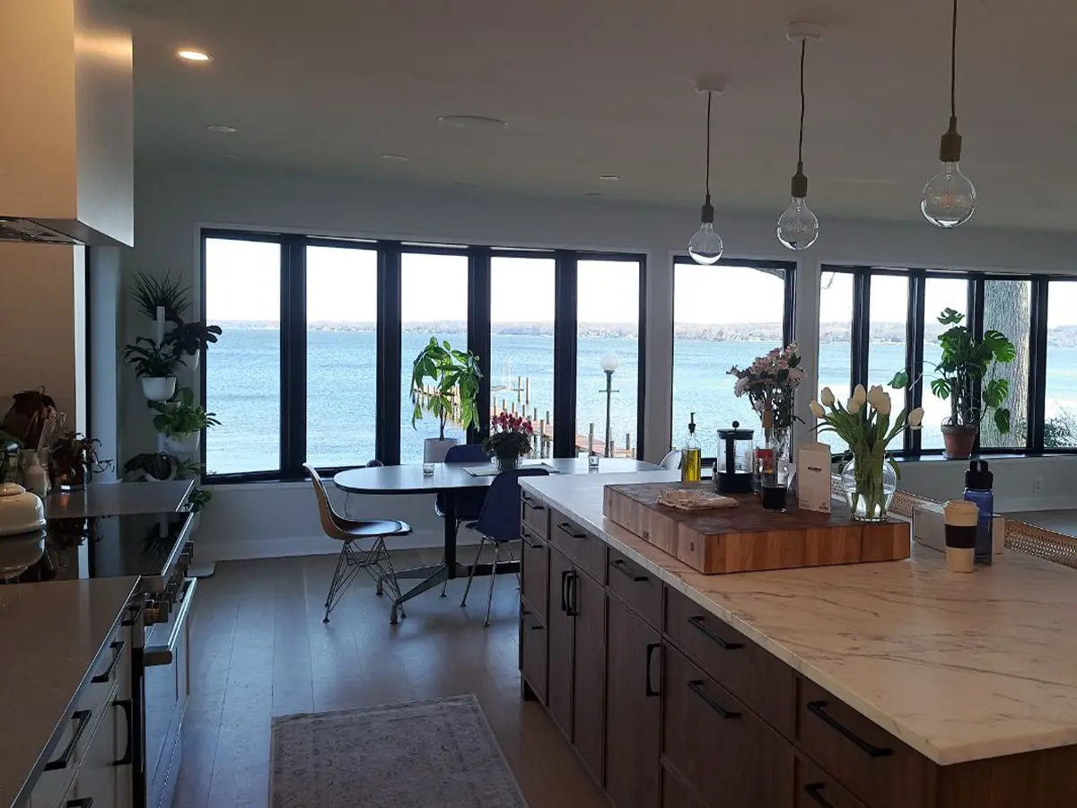 Open-concept kitchen with island and lakefront view