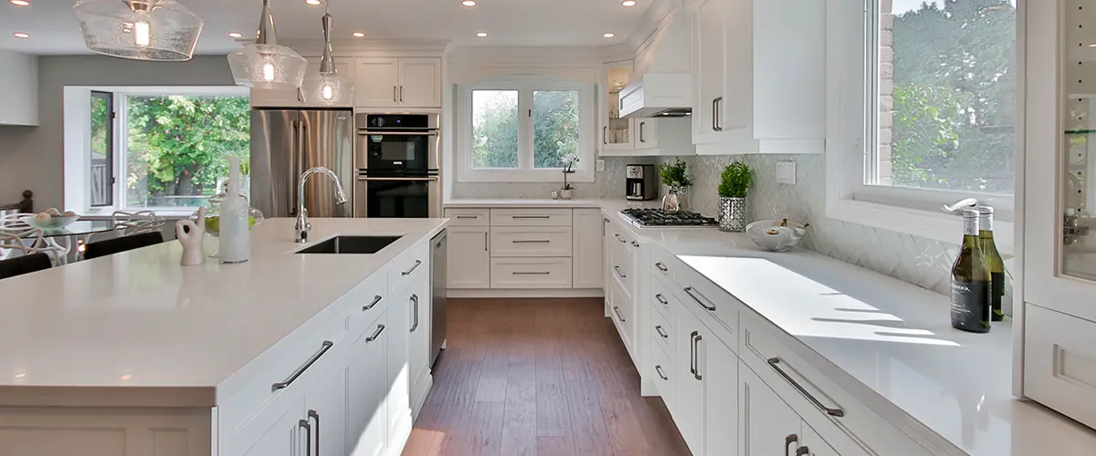 Bright kitchen remodel with white cabinets and island
