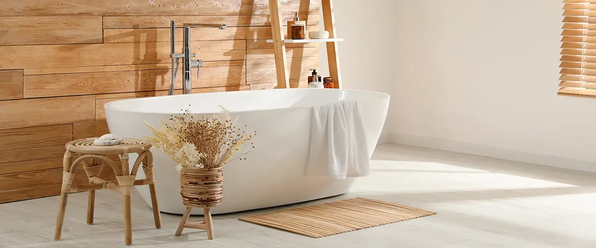 Minimalist bathtub setup with wooden wall accents