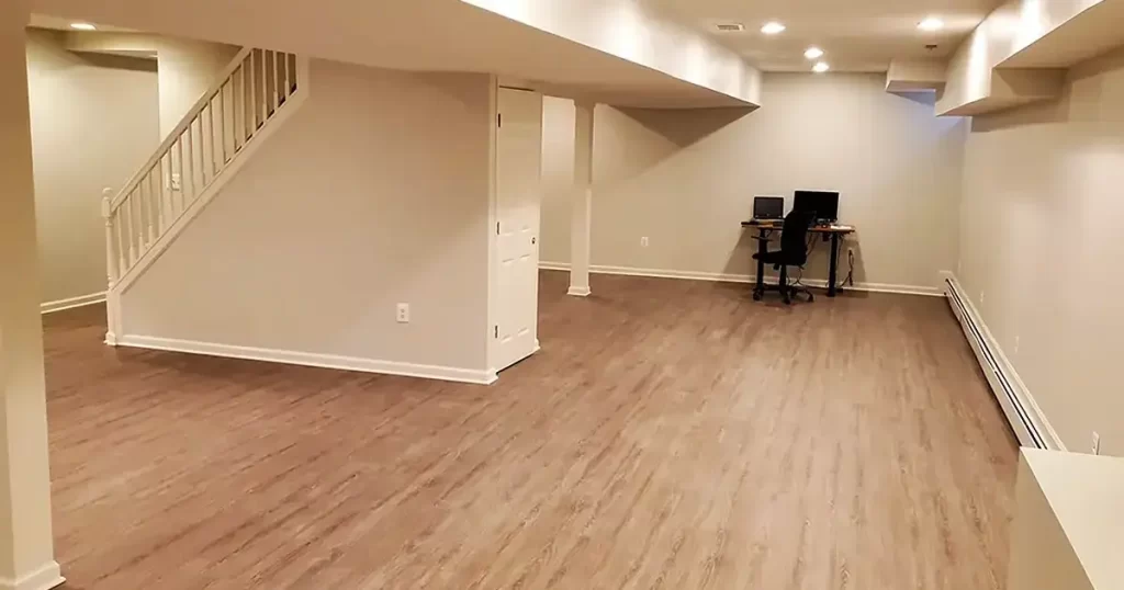 Finished basement with wood flooring and home office setup