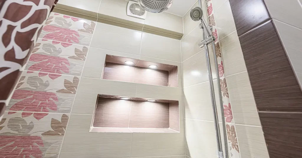 Shower niche with built-in lighting and modern tile design