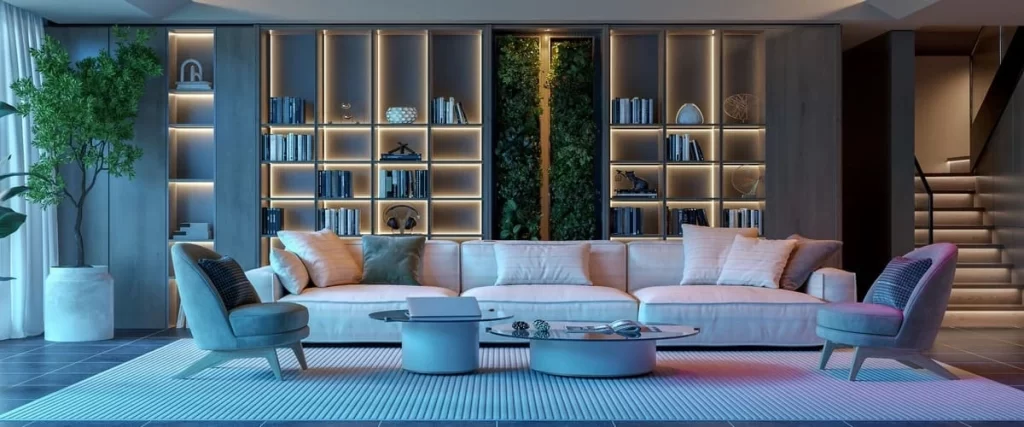 A modern basement living area featuring a large white sectional sofa, blue and purple ambient accent lighting, and a floor-to-ceiling backlit bookshelf wall with a vertical indoor garden.
