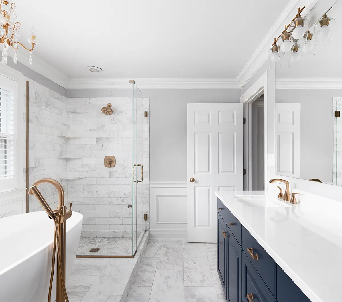 a bathroom with custom vanity, walk in shower, and freestanding tub