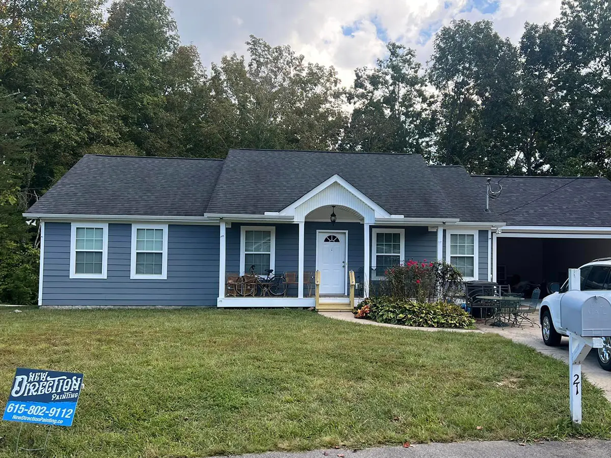 Blue house with porch and garden