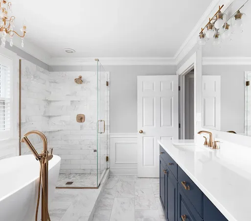 a bathroom with custom vanity, walk in shower, and freestanding tub