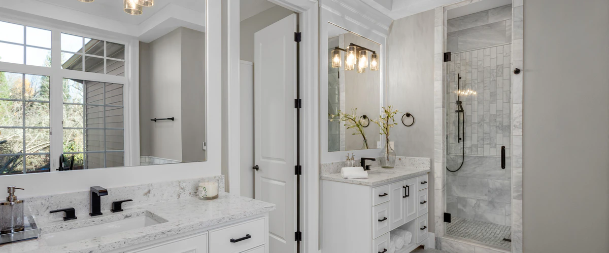 Wide shot of a bright and clean minimalist bathroom with modern decor.